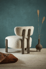 The Sella Chair by BOSQUE — Understated elegance in plush cream and sleek wood.