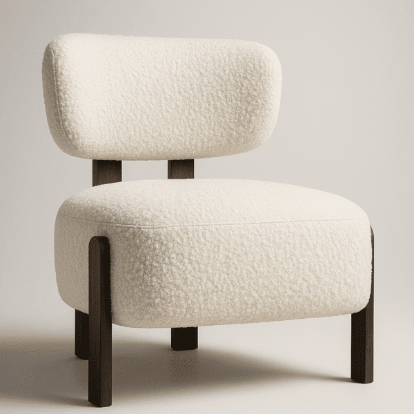 Sella cream upholstered chair with cushioned seat and backrest, supported by dark wooden legs in a minimalist interior setting.