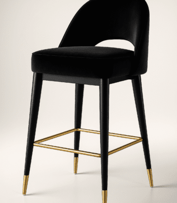 Black velvet bar chair with a curved backrest and gold-accented legs, featuring a gold footrest — BOSQUE’s Eclipse model, designed for modern luxury interiors.