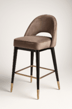 Luxurious mocha-colored bar chair with cushioned seating, gold-tipped black legs, and a gleaming footrest — the Mocha Bar Chair by BOSQUE.