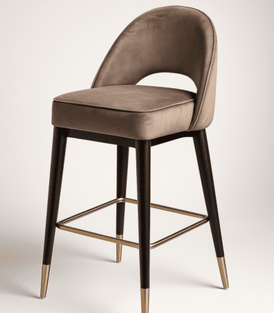 Luxurious mocha-colored bar chair with cushioned seating, gold-tipped black legs, and a gleaming footrest — the Mocha Bar Chair by BOSQUE.
