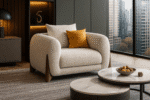 Avessa beige armchair by BOSQUE with wooden legs and mustard pillow in a modern living room