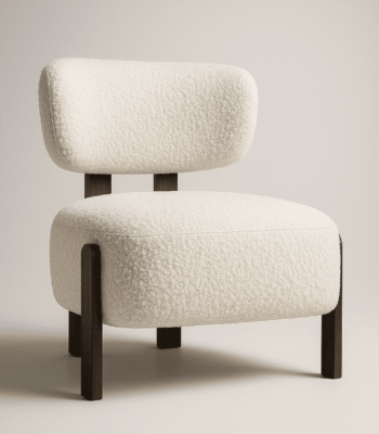 Sella cream upholstered chair with cushioned seat and backrest, supported by dark wooden legs in a minimalist interior setting.