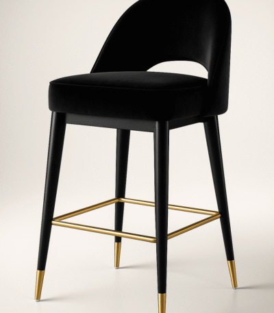 Black velvet bar chair with a curved backrest and gold-accented legs, featuring a gold footrest — BOSQUE’s Eclipse model, designed for modern luxury interiors.